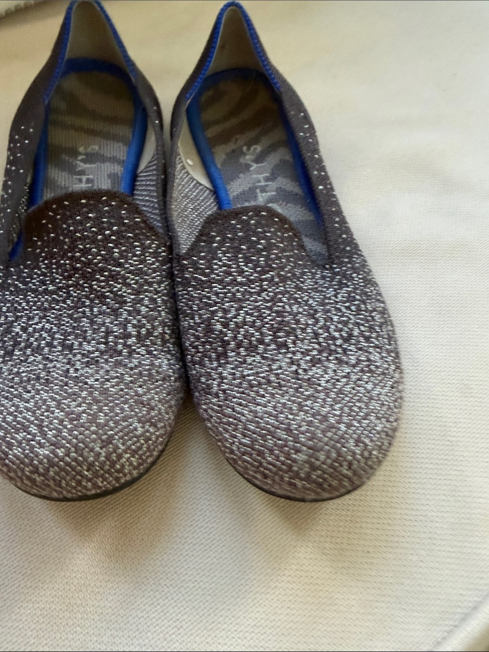 Rothy's Sparkle Knit Slip-Ons in Metallic Gray with Blue Trim